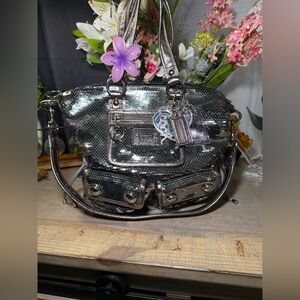 This is a Vintage Coach Poppy Spotlight bag